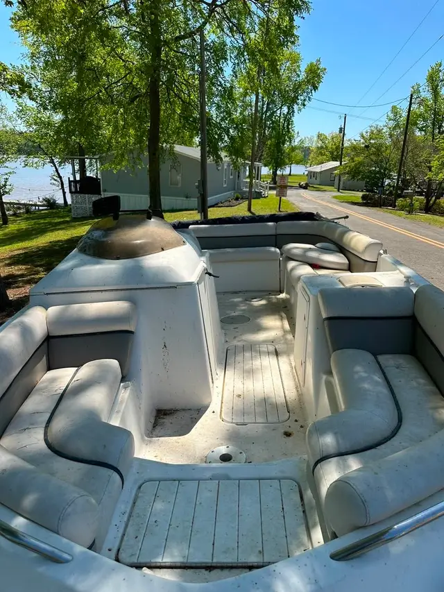 Deck boat bow seating under tree shade